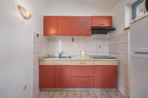 Kuchyň nebo kuchyňský kout v ubytování Apartments Lapida