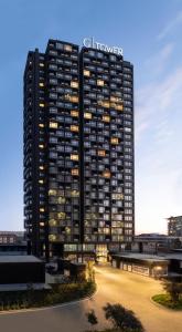 a tall black building with a sign on it at G Tower Furnished Apartment Rentals in Istanbul
