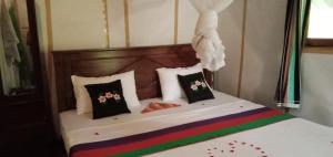 Ein Bett oder Betten in einem Zimmer der Unterkunft Sigiri Panaromic Tree House
