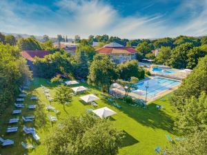 an overhead view of a resort with a pool and tents at Hotel Rottaler Hof in Bad Birnbach
