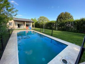 a swimming pool in the backyard of a house at Corazón de Buey in Gualeguaychú