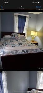 a bedroom with a bed and a window at Royalbluecozy in Saint Albans