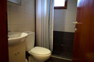 a bathroom with a toilet and a sink and a shower at Holiday aptm - MorningSun2 - Sithonia in Ayios Nikolaos Sithonia +20 photos