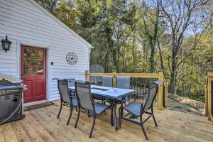a patio with a table and chairs and a grill at Peaceful Renovated Home with Deck on Half Acre! in Asheboro
