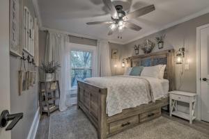 a bedroom with a bed and a ceiling fan at Peaceful Renovated Home with Deck on Half Acre! in Asheboro