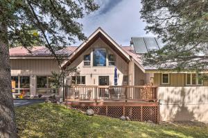a house with a large porch with a deck at Monte Verde Lake Lodge with Hot Tub 4 Mi to Ski in Angel Fire