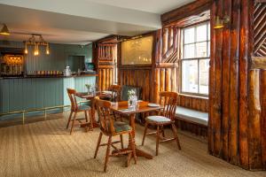 a dining room with a table and chairs at The Crusoe in Leven-Fife