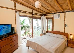 Postel nebo postele na pokoji v ubytování Hotel Grandmare & Bungalows