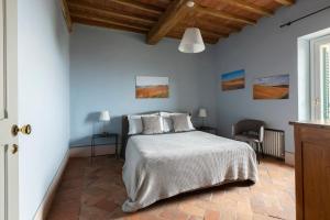 Postel nebo postele na pokoji v ubytování Tuscany View Montalcino