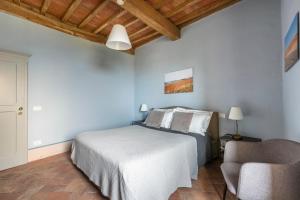 Postel nebo postele na pokoji v ubytování Tuscany View Montalcino