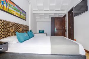 Giường trong phòng chung tại Ayenda La Tua Casa