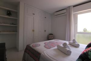 Posteľ alebo postele v izbe v ubytovaní Altaia Apartment