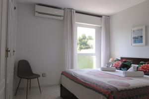 Posteľ alebo postele v izbe v ubytovaní Altaia Apartment