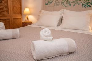 Postel nebo postele na pokoji v ubytování Barbati Boutique Studio