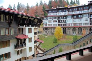a view of a building from a balcony at Гранд Манастира Апартаменти "Зимна приказка" in Pamporovo