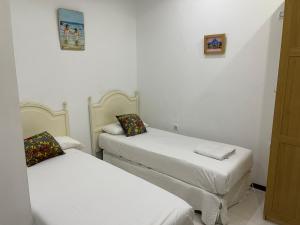 Postel nebo postele na pokoji v ubytování Casas de Sevilla - Apartamento Puente de Triana