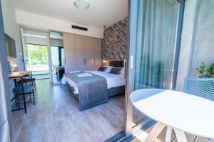 Postelja oz. postelje v sobi nastanitve ARGENTO RESIDENCE