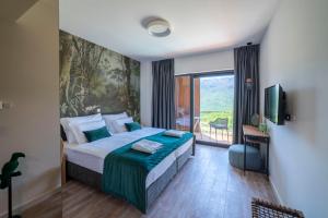 Postelja oz. postelje v sobi nastanitve ARGENTO RESIDENCE