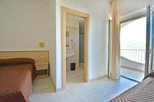 Postel nebo postele na pokoji v ubytování Hotel Incanto