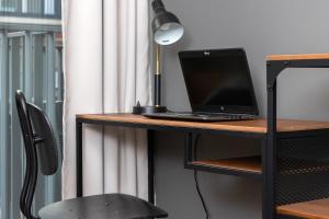 Televízia a/alebo spoločenská miestnosť v ubytovaní Rajska 8 Apartments Old Town Gdańsk by Renters Prestige