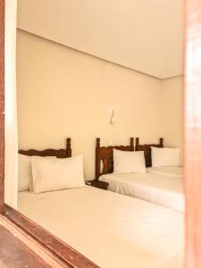 Vila Sancar Pousada客房内的一张或多张床位