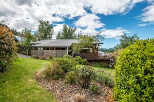 a house with a garden in front of it at 34 Denby Place in Hanmer Springs