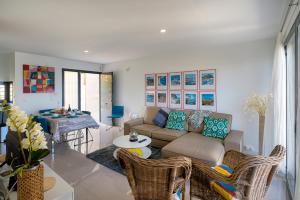 a living room with a couch and a table at Casa Vistamar in Altea