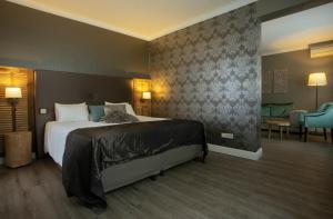 Ein Bett oder Betten in einem Zimmer der Unterkunft Hotel Mardaga