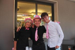 two men and a woman wearing pink bow ties at Hotel Villa Boschetti in San Mauro a Mare +56 photos