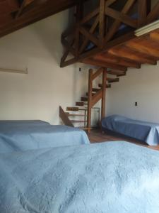 מיטה או מיטות בחדר ב-Tanino Guest House