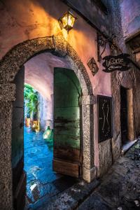 an archway in a tunnel with a water canal at La Corte del Governo 565 in Lezzeno