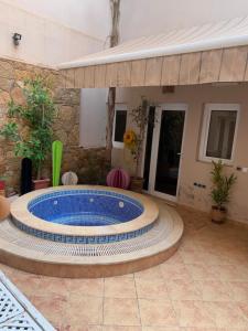 a pool in the middle of a patio at residence Europa in Mirleft