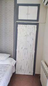 a door in a room with a bed and a window at Hostal Romero in Madrid