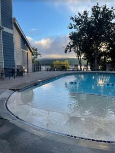 a large swimming pool in front of a building at Port of Kimberling Marina & Resort in Kimberling City