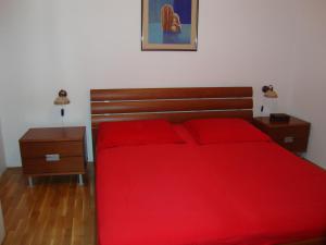 Postel nebo postele na pokoji v ubytování Longo Apartment