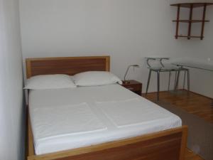 Postel nebo postele na pokoji v ubytování Longo Apartment