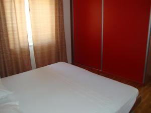 Postel nebo postele na pokoji v ubytování Longo Apartment