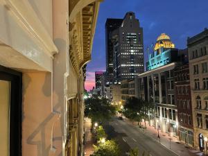a view of a city street at night from a building at Luxury City Escape & Peaceful Retreat by Hollyhock in Louisville