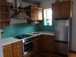 Kuchyň nebo kuchyňský kout v ubytování Longo Apartment