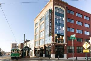 a trolley is parked in front of a building at ARRIVE Memphis in Memphis