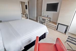 Katil atau katil-katil dalam bilik di GHL Hotel Neiva