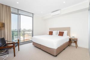 Postel nebo postele na pokoji v ubytování Nautica Residences Fremantle