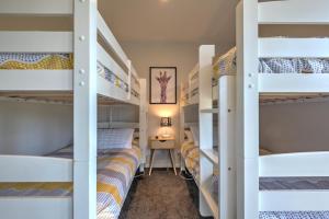 a bedroom with bunk beds in a dorm room at 49 St James Avenue in Hanmer Springs