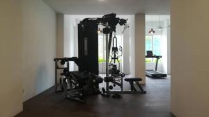 a room with a gym with two exercise bikes at The Awantara Homestay - Seroja Hills in Sepang