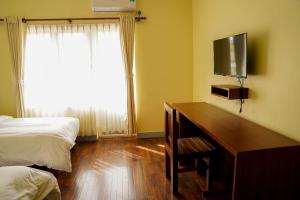 TV a/nebo společenská místnost v ubytování HOTEL CLAIRE INN