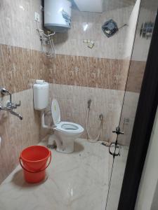a bathroom with a toilet and a shower at White Rabbit Guest House in Shillong