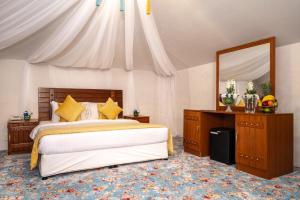 Voodi või voodid majutusasutuse Regency Sealine Camp toas