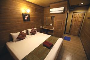 Tempat tidur dalam kamar di Thai Cozy House - SHA certified