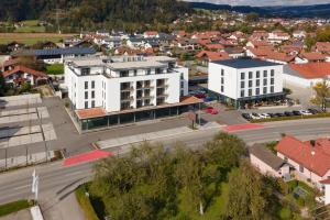 an aerial view of a city with a white building at Motel Inn Simbach in Simbach am Inn