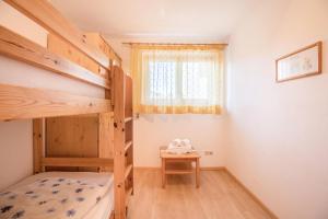 Postel nebo postele na pokoji v ubytování Bnb Lettnerhof Terrace Family Suite